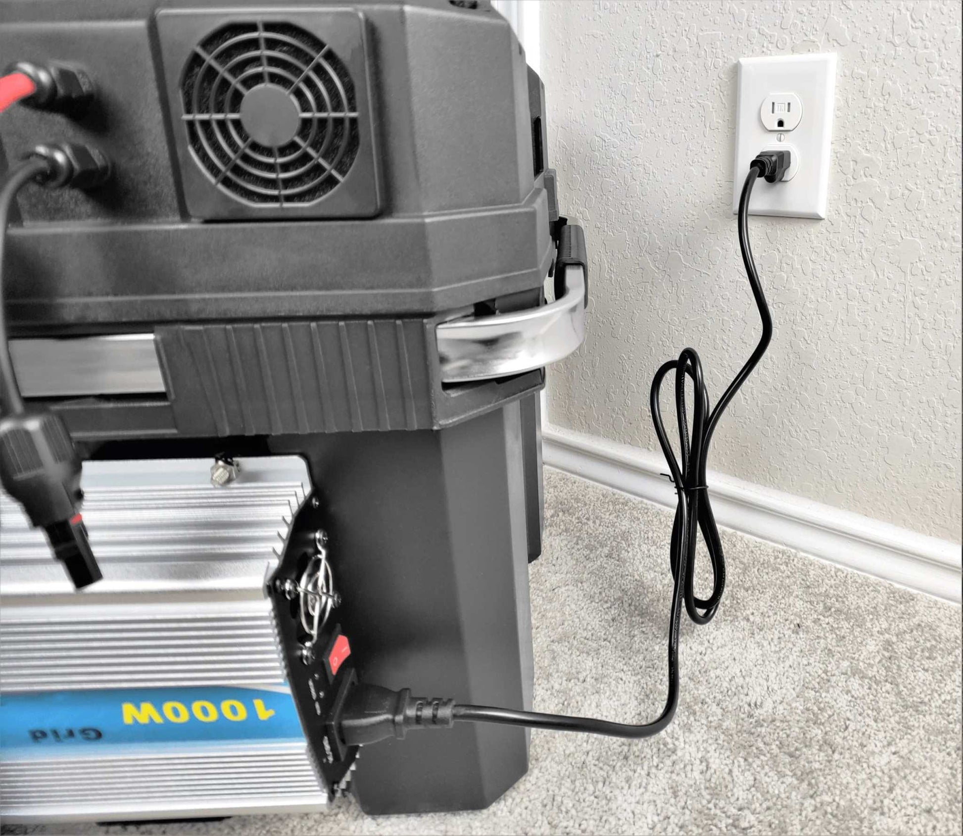 Sunshine Supercharger 4,000W generator plugged into wall outlet, showcasing dual on-grid/off-grid power capabilities.